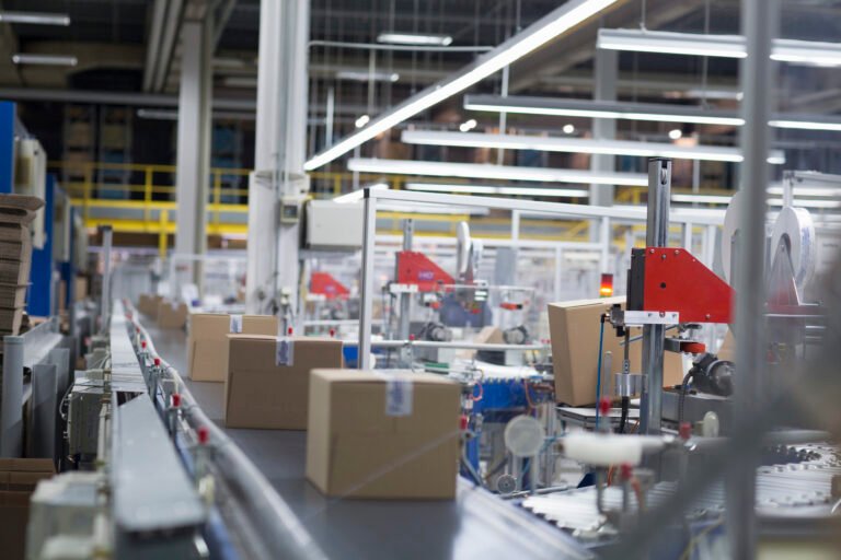 Boxes on production line at paper packaging factory