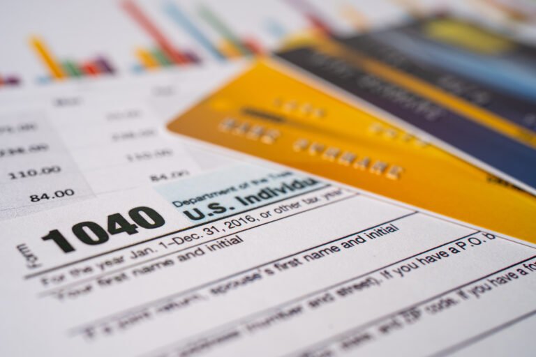 Tax Return form 1040 and dollar banknote, U.S. Individual Income
